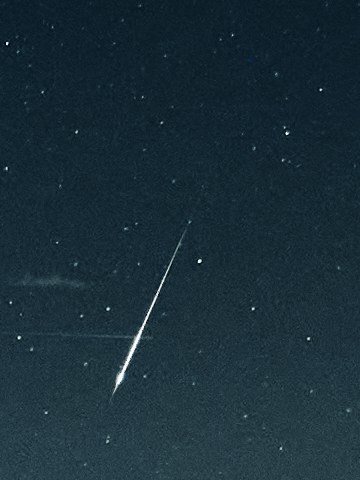 Before: a bright Perseid meteor, fat in the middle and thin at the ends