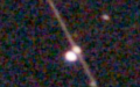 Before, 4 times enlarged: a bright star and a faint star sit on the trail