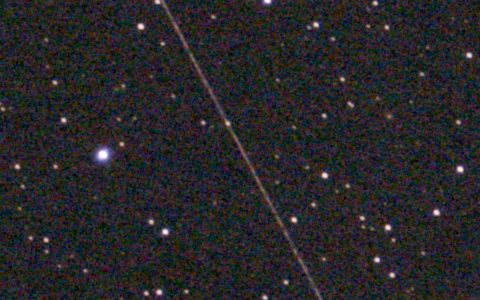 Before: a thin satellite trail crosses a field of stars