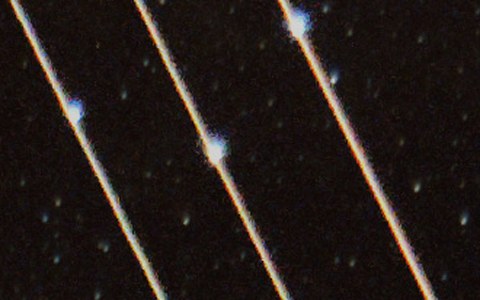 Before, enlarged: three bright lines, each passing over a bright star