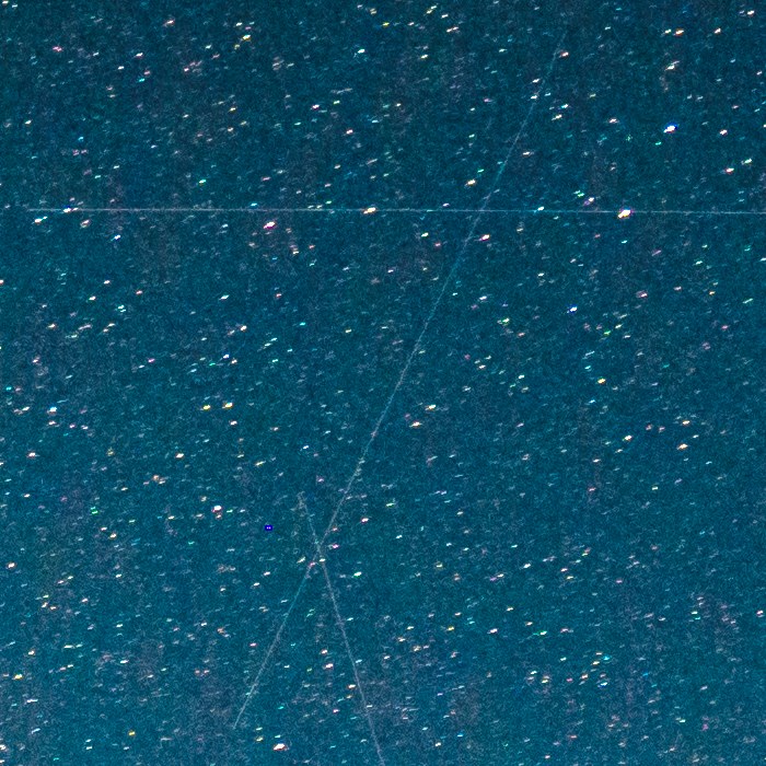 Before: a full size crop of a real night frame, with three satellite trails across the stars