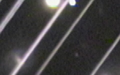 Before: wide, bright satellite trails across a telescope image of galaxies